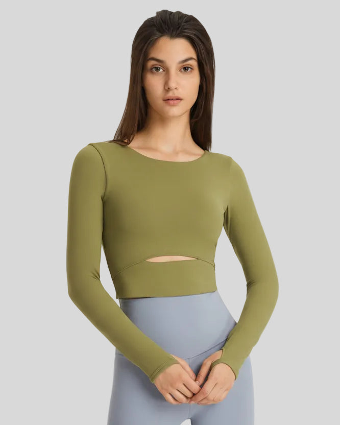 Angled view of green FlowCut Studio Top with stretch fabric