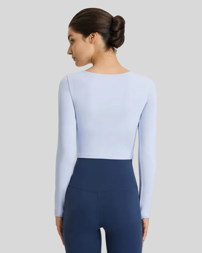 Back view of sky blue FlowCut Studio Top with studio-ready fit