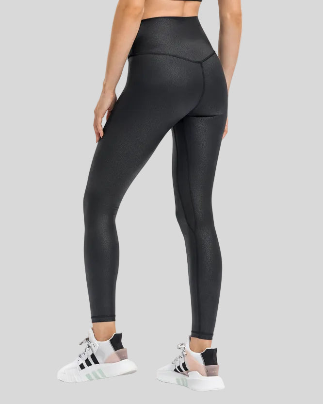 Back angle view of black FlowEase High-Waist Pocket Legging with seamless silhouette
