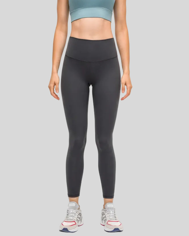 Front view of FlowEase High-Waist Pocket Legging in dark gray with clean matte finish
