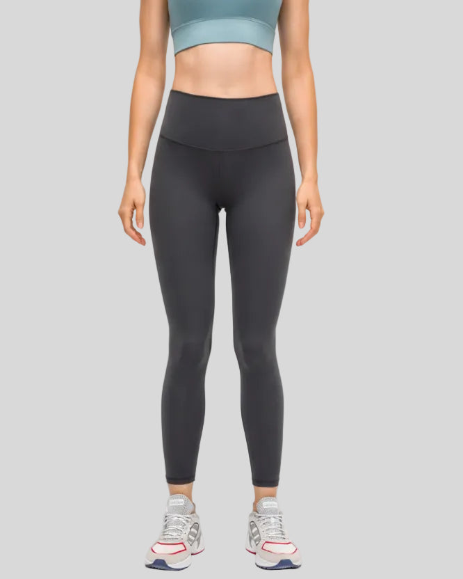 Front view of FlowEase High-Waist Pocket Legging in dark gray with clean matte finish