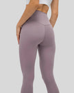 Back closeup of FlowEase High-Waist Pocket Legging in pink purple, highlighting smooth matte fabric