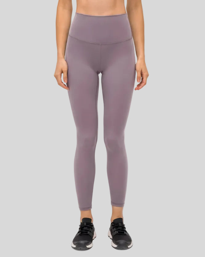 Front view of FlowEase High-Waist Pocket Legging in pink purple with clean matte finish