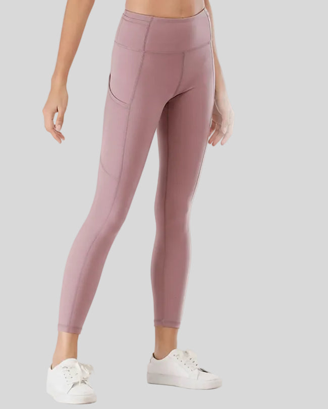 Front angled view showing the relaxed, flattering fit of the FlowEase Pocket Legging in dusty pink