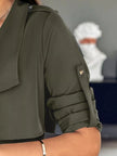Athlesi FlowForm trench army green closeup showing fabric texture and sleeve detail