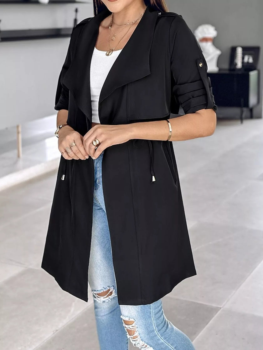 Athlesi FlowForm trench black semi open front showing adjustable waist and fluid silhouette