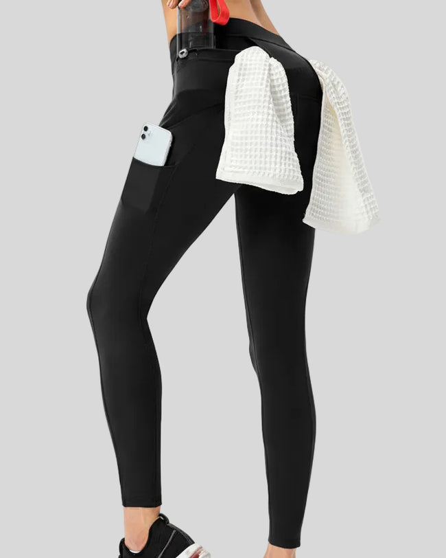 Angled back view highlighting the utility-inspired construction and athletic finish in black