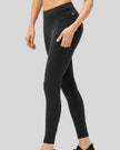 Left side view of black Athlesi FlowForm Utility Legging emphasizing pocket placement and slim fit