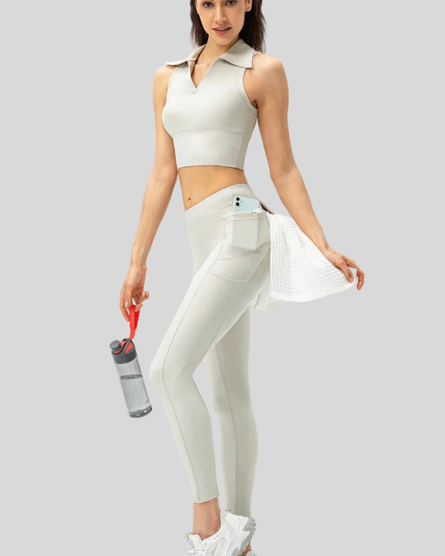 Left side view of white Athlesi FlowForm Utility Legging emphasizing pocket placement and slim fit