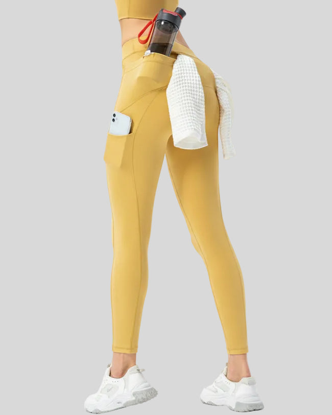 Angled back view highlighting the utility-inspired construction and athletic finish in gold