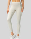 Front view of Athlesi FlowForm Utility High-Waist Legging in white with a sleek, athletic fit.