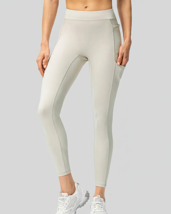 Front view of Athlesi FlowForm Utility High-Waist Legging in white with a sleek, athletic fit.