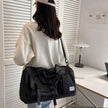 Model carrying FlowHold Carry Bag on shoulder styled for gym and studio movement