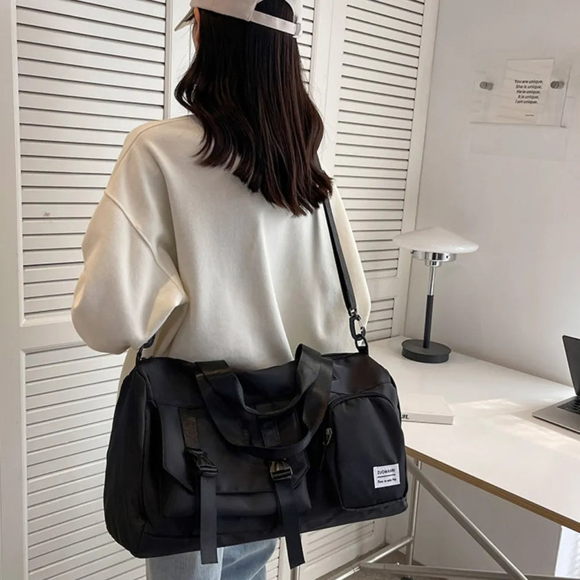 Model carrying FlowHold Carry Bag on shoulder styled for gym and studio movement