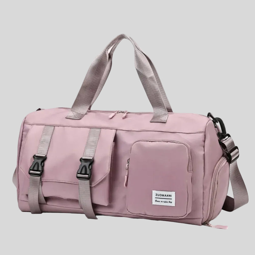FlowHold Carry Bag in dusty pink with structured design and front utility pockets