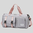 FlowHold Carry Bag in gray with structured design and front utility pockets