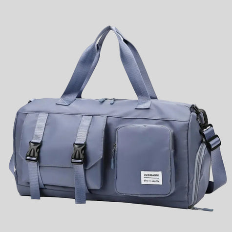 FlowHold Carry Bag in light indigo with structured design and front utility pockets