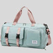 FlowHold Carry Bag in turquoise with structured design and front utility pockets