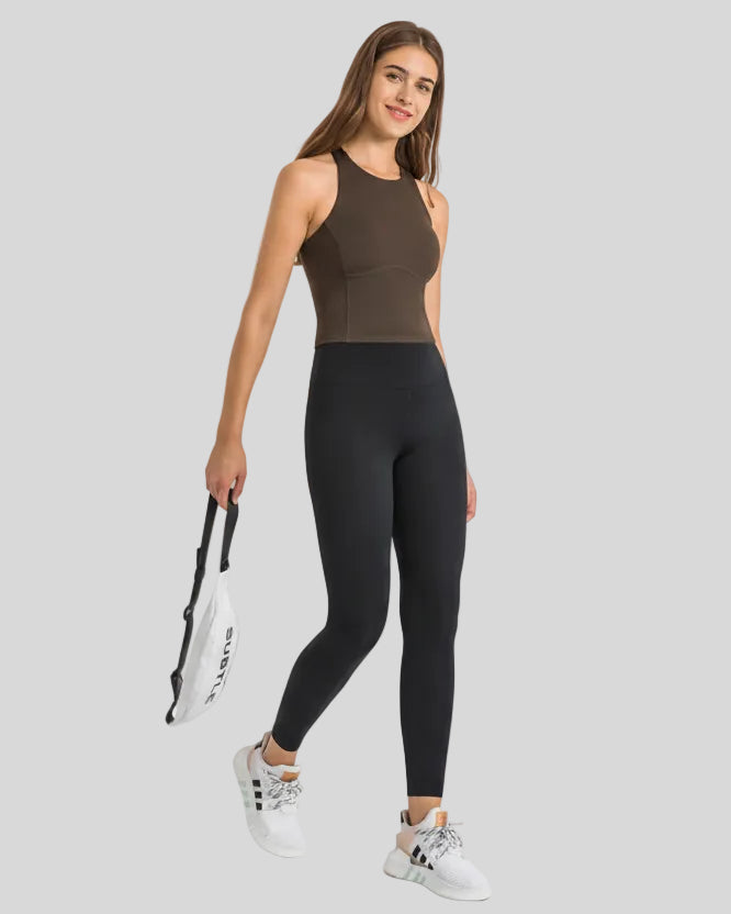 Angled front view of Athlesi FlowLine Core legging in black