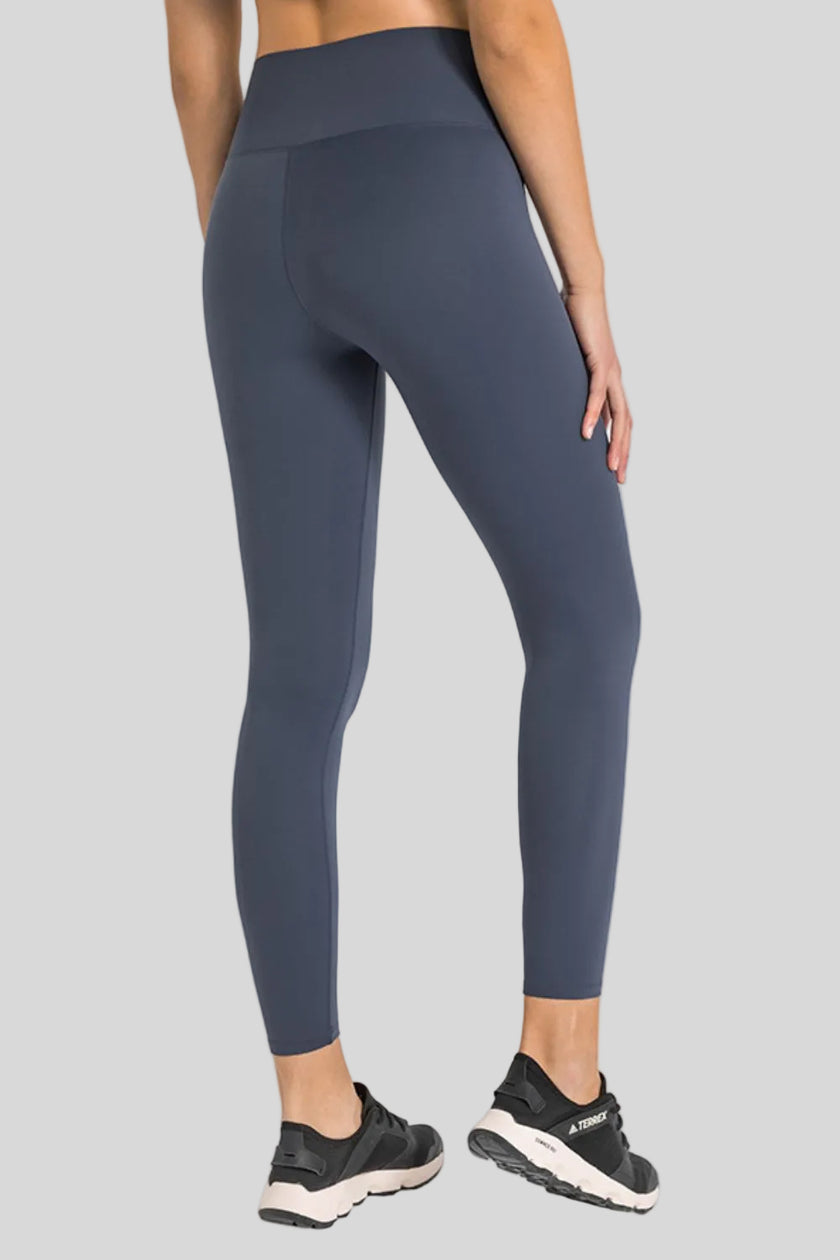 Back view of Athlesi FlowLine Core legging in dark navy