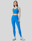 Full body front view of FlowLine Core Legging in blue
