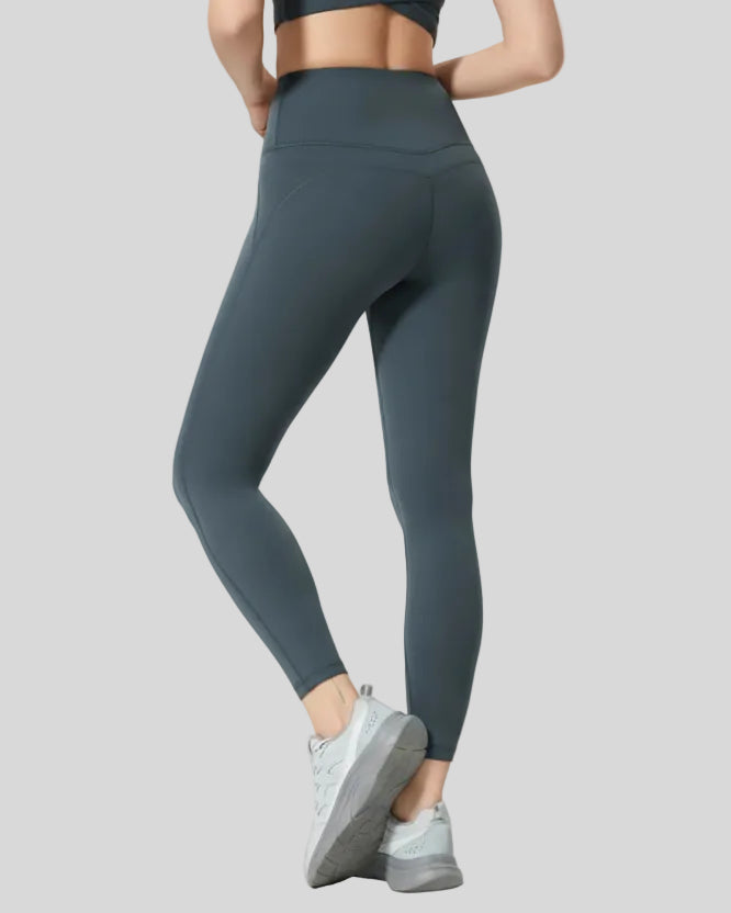 Back angle view of FlowLine Core Legging in dark gray