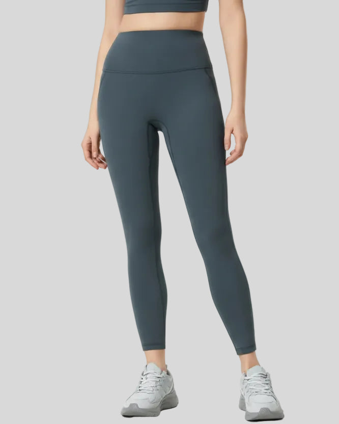 Front angle view of dark gray FlowLine Core Legging with wide waistband