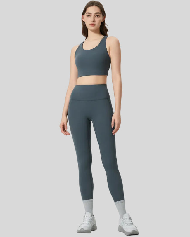 Full body front view of FlowLine Core Legging in dark gray