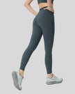 Right side view of FlowLine Core Legging in dark gray