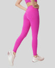 Back angle view of FlowLine Core Legging in fuchsia pink