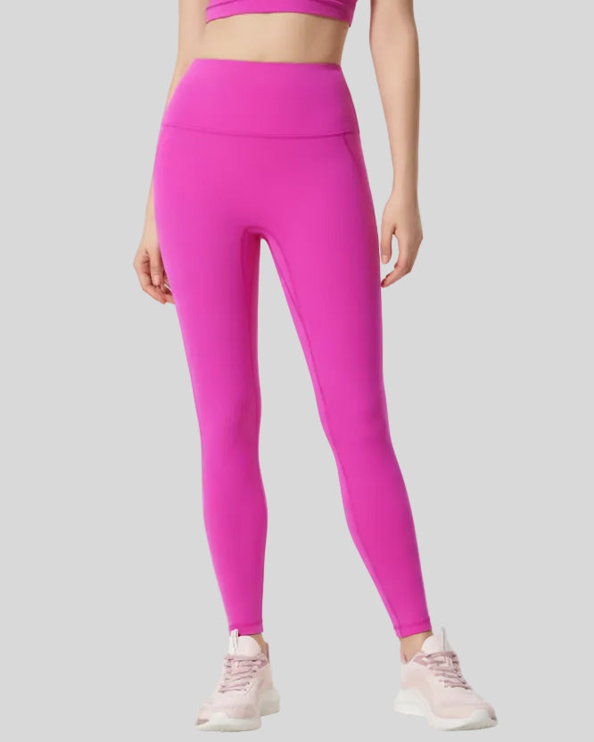 Front angle view of fuchsia pink FlowLine Core Legging with wide waistband