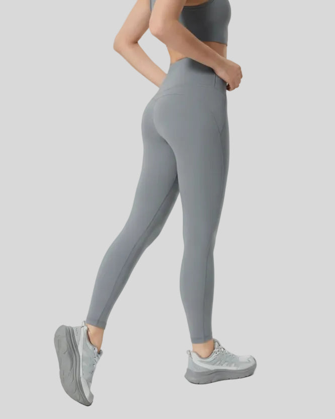 Back angle view of FlowLine Core Legging in gray