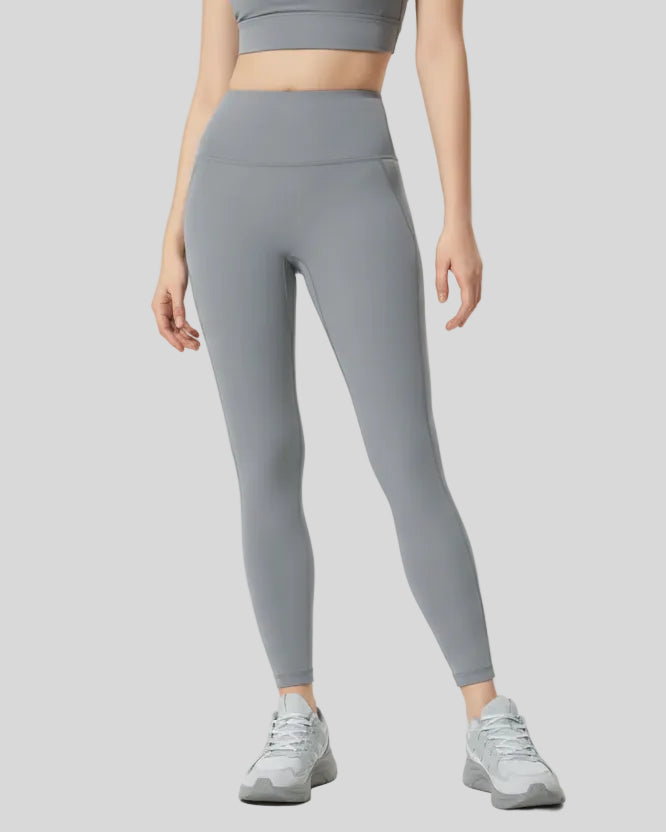 Front angle view of gray FlowLine Core Legging with wide waistband