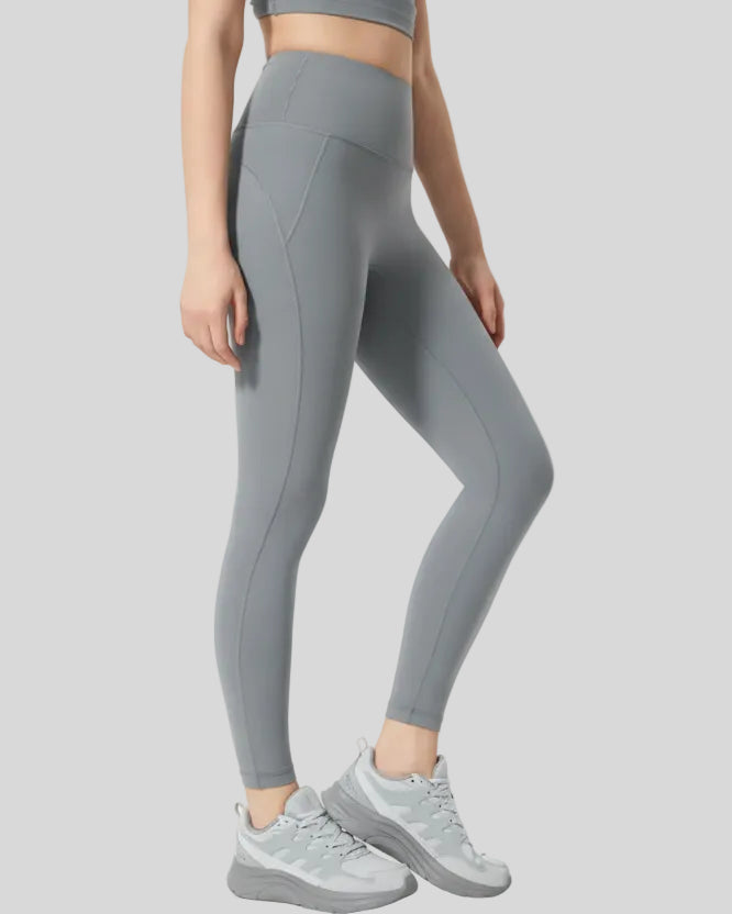 Right side view of FlowLine Core Legging in gray