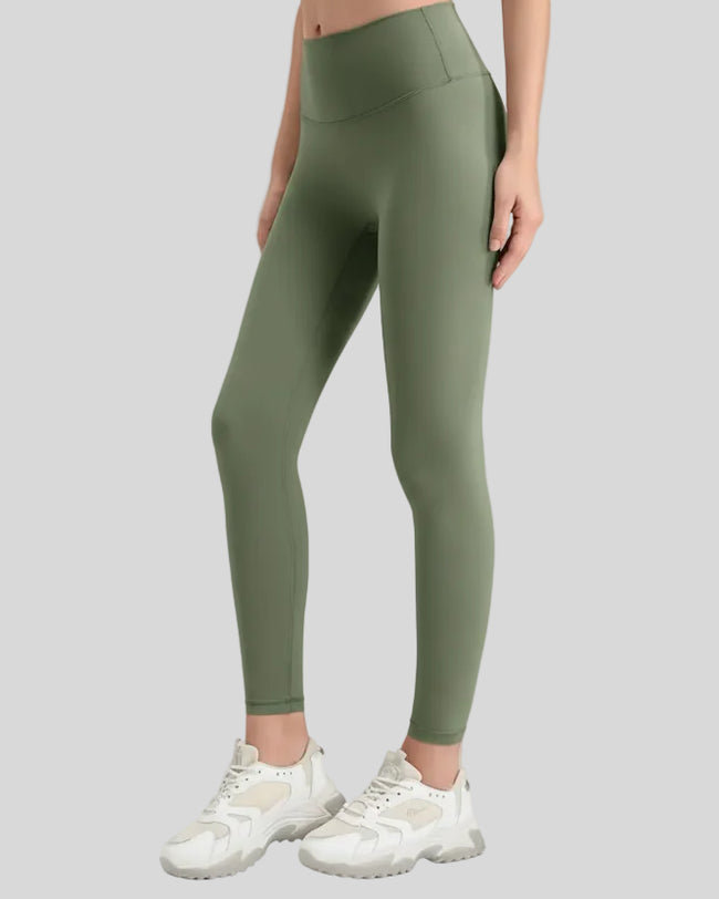 Side view of FlowLine Core Legging minimal in moss