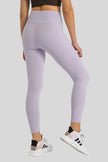 Back view of Athlesi FlowLine Core legging in pink purple