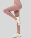 Side view of smooth FlowLine Core Legging with high-waist fit in dusty pink