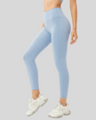 Light blue FlowLine Core Smooth leggings worn by a woman on a gray background