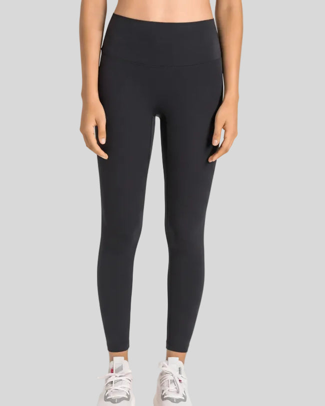 High-rise waistband of FlowLine Hold Legging in Black - Athlesi