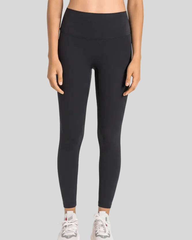 High-rise waistband of FlowLine Hold Legging in Black - Athlesi