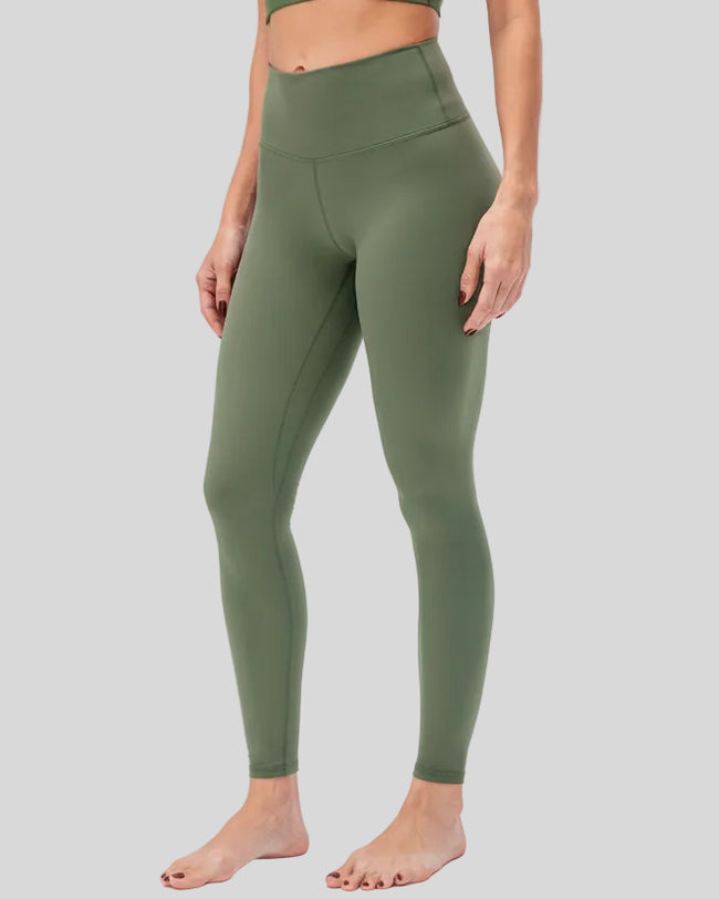 Front angle view of matcha green FlowLine Hold Legging with center stitching detail