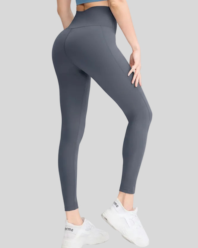 Back angle view of FlowLine Hold Legging in dark gray highlighting smooth high-waist fit