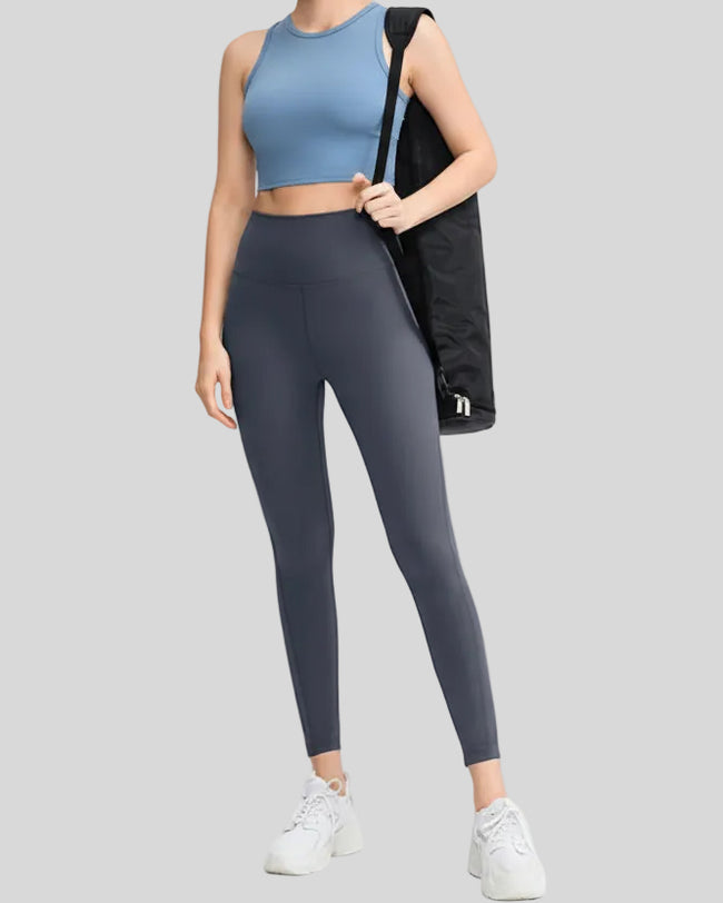 FlowLine Hold Legging in dark gray shown from front angle with center stitching