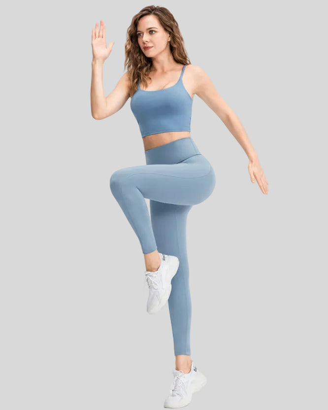 Full body front angle view of FlowLine Hold Legging in light blue with slim fit silhouette