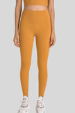 High-rise waistband of FlowLine Hold Legging in Tangerine - Athlesi
