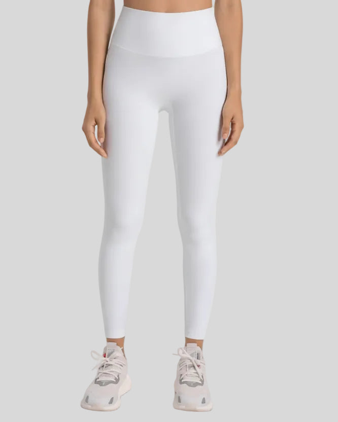 High-rise waistband of FlowLine Hold Legging in White - Athlesi