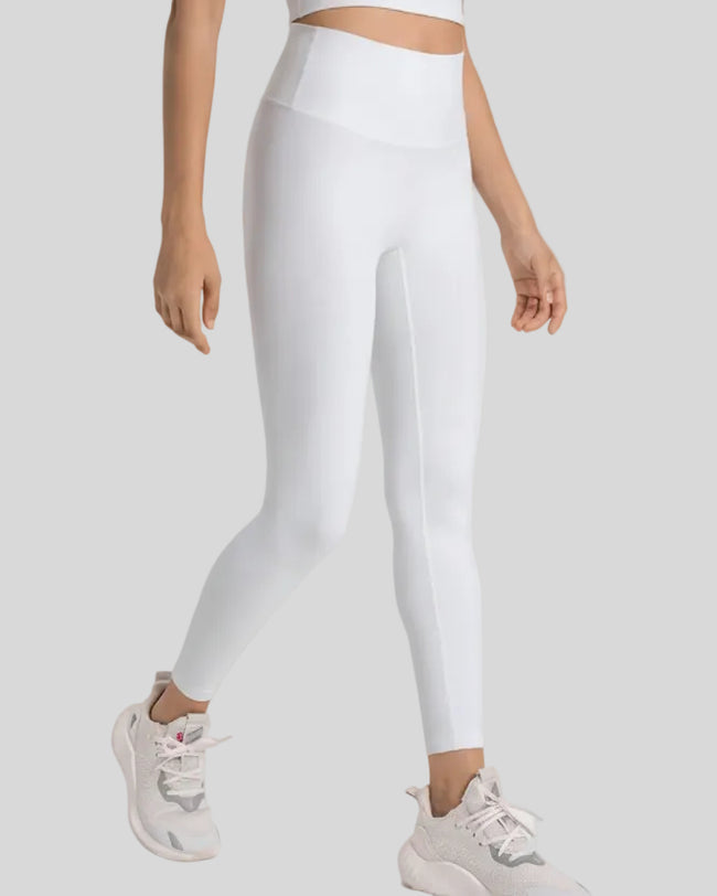 Body-hugging silhouette of FlowLine Hold Legging in White - Athlesi