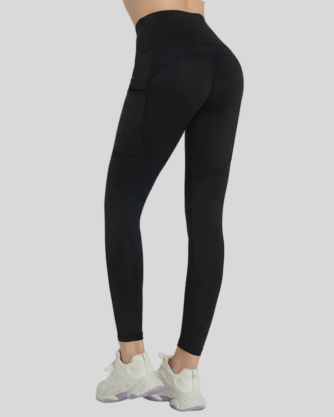Back angle view showing a streamlined fit and refined construction of the FlowLine Hold Pocket Legging in black