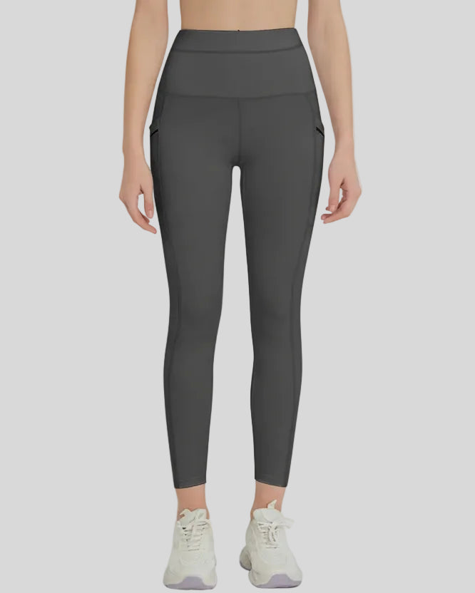 Front view of Athlesi FlowLine Hold Pocket Legging in dark gray with a clean, high-waist silhouette
