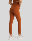 Back view of FlowLine Hold Soft Legging in brown with center stitching detail